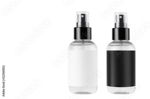 Two spray bottles for cosmetics product with black, white blank labels isolated on white background, mock up for branding, advertising, design.