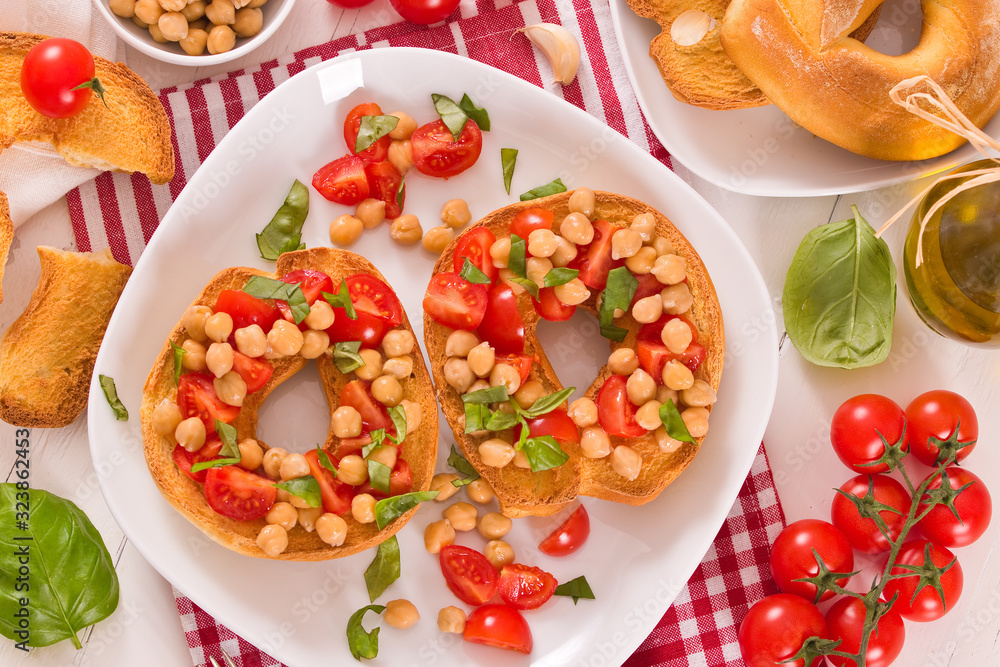 Friselle with tomatoes and chickpeas. Friselle with tomatoes and chickpeas.