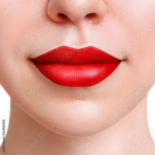 Beautiful natural lips with red color lipstick.