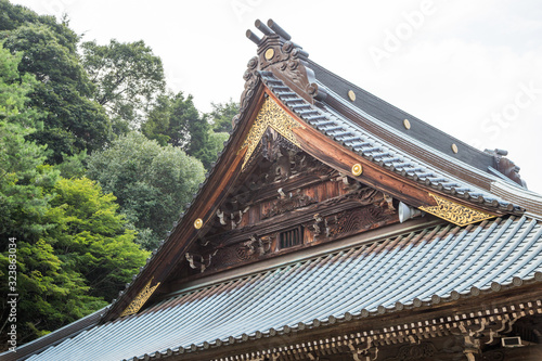 Detail of the decoration of an old Japanese wooden house with golden touches