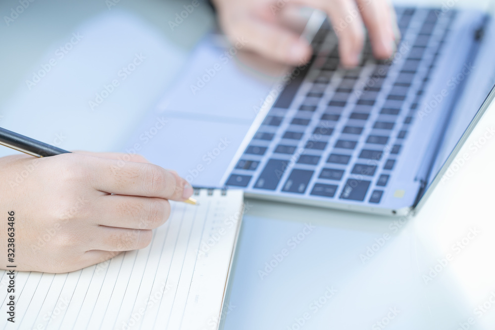 Woman working at home office using laptop searching web, browsing information Woman working at home office using laptop searching web, browsing information