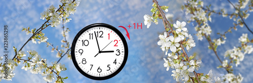 Daylight Saving Time (DST). Blue sky with white clouds and clock. Turn time forward (+1h).