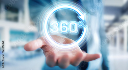 Foto Man using 360 degree virtual reality neon interface 3D rendering