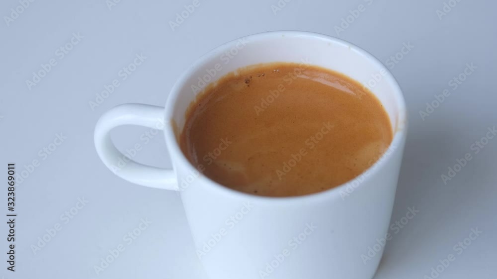 Fresh aroma espresso with creams on white table background. Coffee is served to the client in the morning. Fresh aroma espresso with creams on white table background. Coffee is served to the client in the morning.