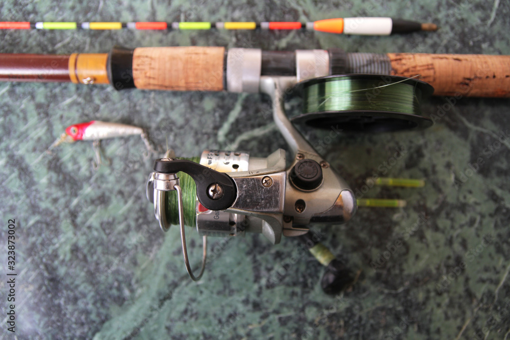 spinning with a reel with a wobbler and a float. Preparing for spring fishing. spinning with a reel with a wobbler and a float. Preparing for spring fishing.