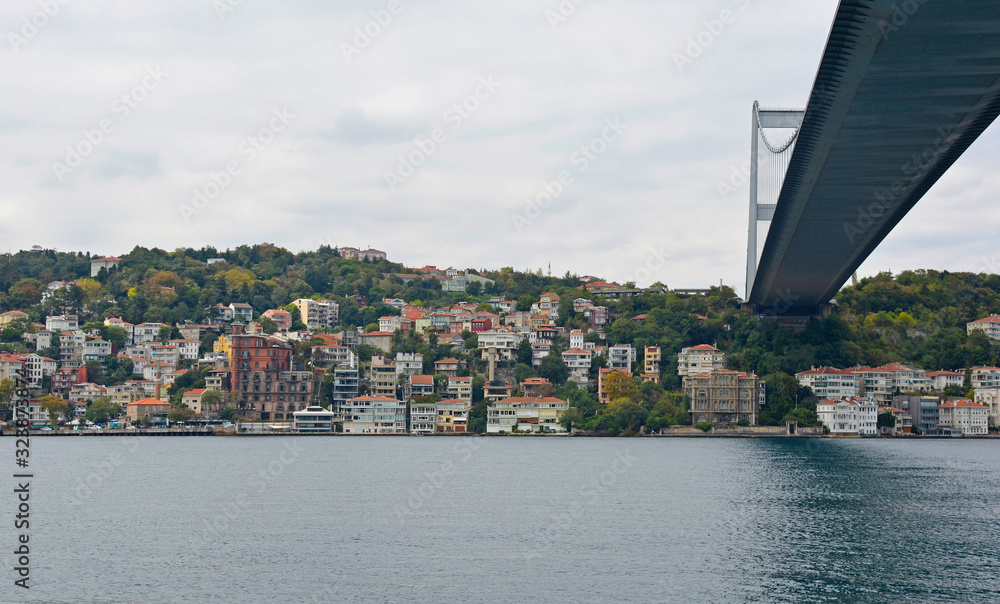 The Fatih Sultan Mehmet Koprusu Bridge in Istanbul, Turkey. This suspension bridge connects Hisarustu in Europe with Kavacik in Asian. Taken from the Asian side, looking at the European side