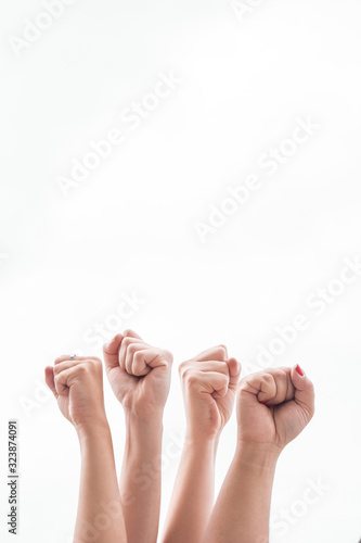 Close-up women holding fists up at gathering