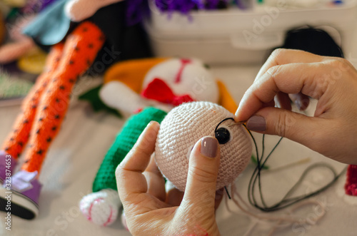 Making colored crochet rabbit.