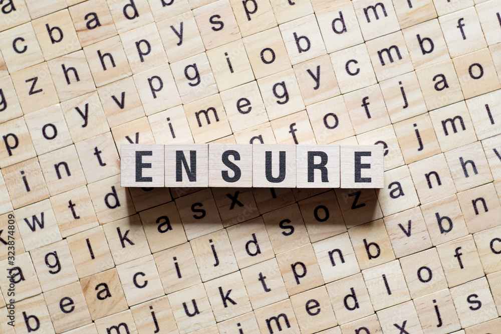 Text Ensure concept on cubes Text Ensure concept on cubes