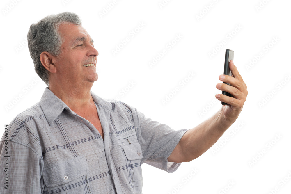 Old man smiling while face timing Old man smiling while face timing