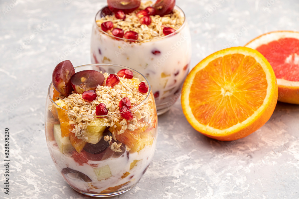 Fruit with yogurt and granola in a glass. Tasty and healthy breakfast Fruit with yogurt and granola in a glass. Tasty and healthy breakfast