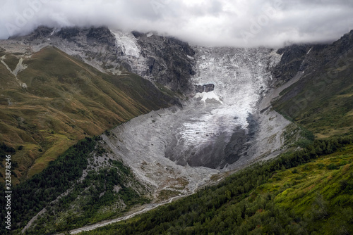 Photos Aerial view to Adishi icefall and tongue with small waterfall on it moraine and