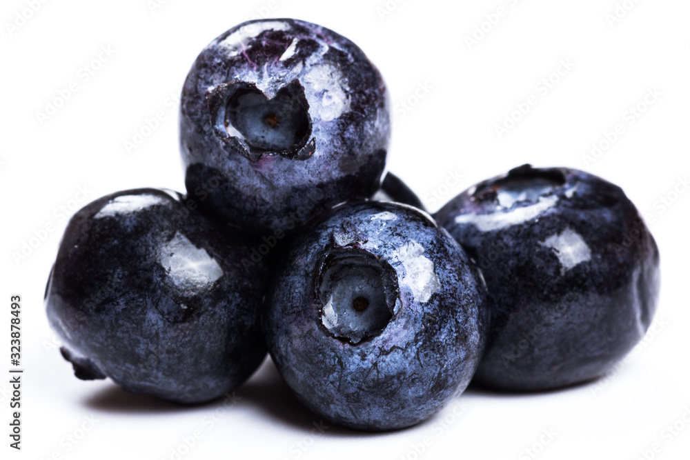a handful of blueberries close-up isolated on white background a handful of blueberries close-up isolated on white background