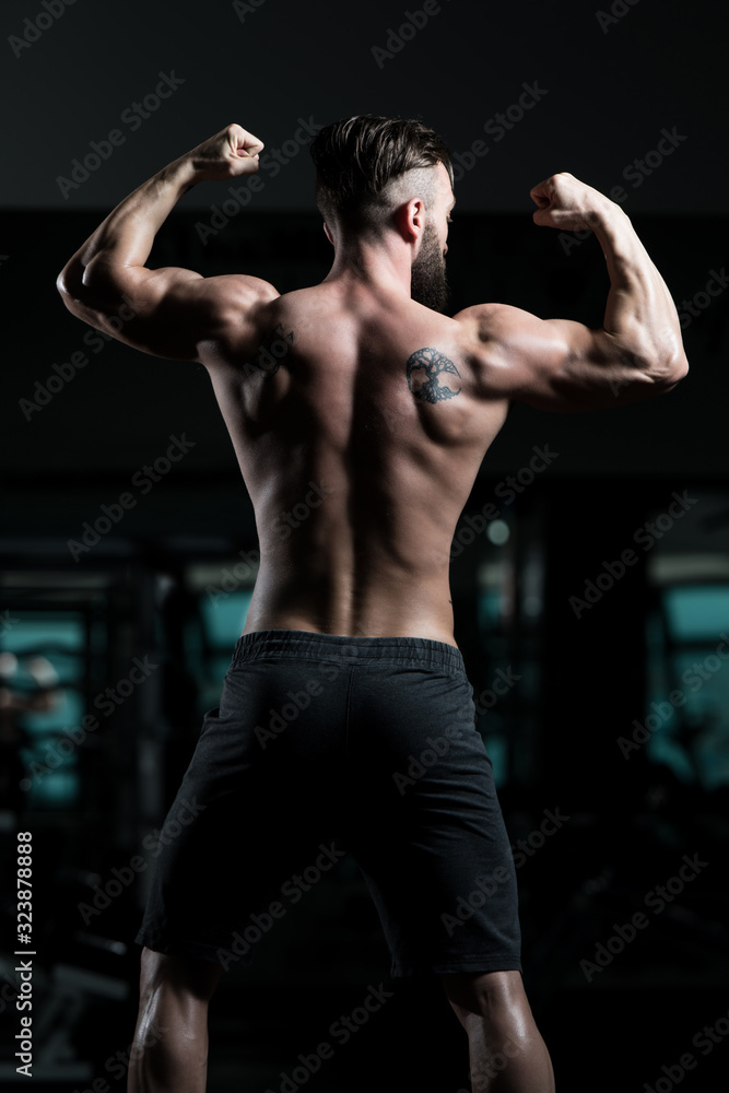 Bodybuilder Performing Rear Double Biceps Pose