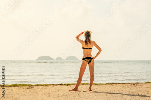 Happy woman enjoying beach in summer