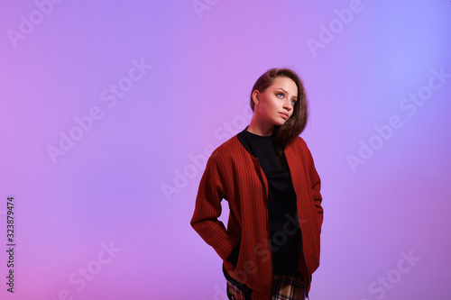 trendy studio fashion image of model, wearing color block clothes, casual spring style, color background, hipster girl posing