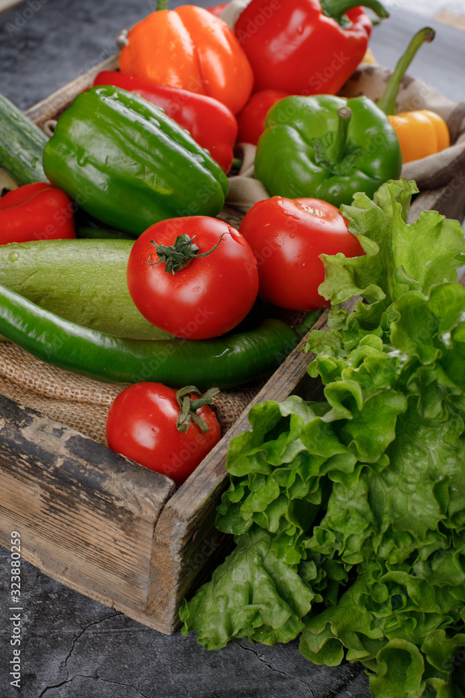 Fresh vegetables with lettuce in a wooden tray. Fresh vegetables with lettuce in a wooden tray.