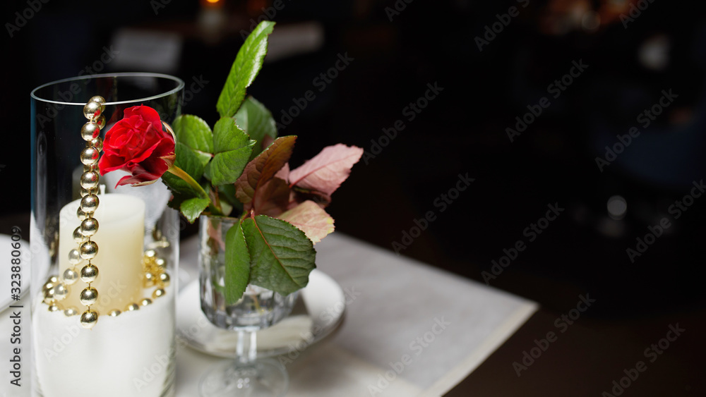 flower fold on tables and a glass with candles, table decor