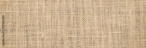 Hessian sackcloth burlap woven texture background/cotton woven fabric background with flecks of varying colors of beige and brown. with copy space. office desk concept. Hessian sackcloth burlap woven.