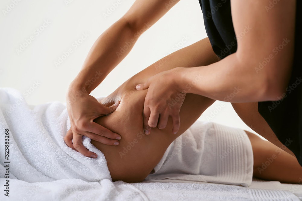 Problems of women body. Close up of anti cellulite massage for young woman in wellness center. Perfect skin fat burning beauty concept Problems of women body. Close up of anti cellulite massage for young woman in wellness center. Perfect skin fat burning beauty concept
