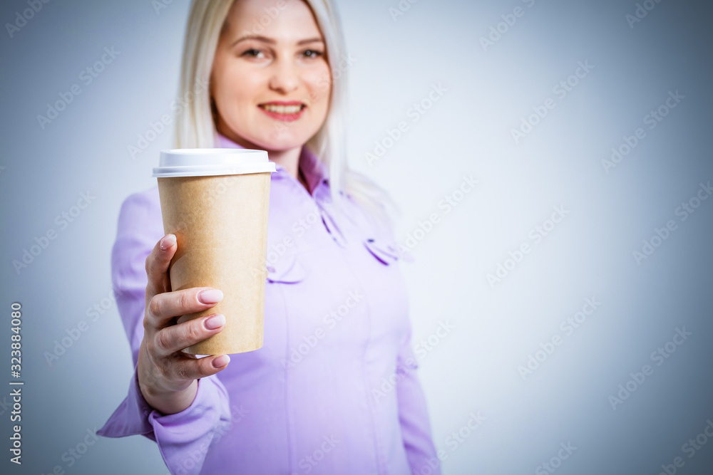 Young beautiful woman drinking paper glass of coffee over isolated white background Young beautiful woman drinking paper glass of coffee over isolated white background