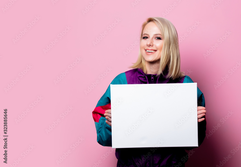 Beautiful blonde woman with banner on pink background