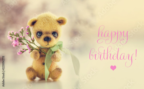 Teddy bear with flowers, text Happy Birthday. Greeting card, poster, background © 8H
