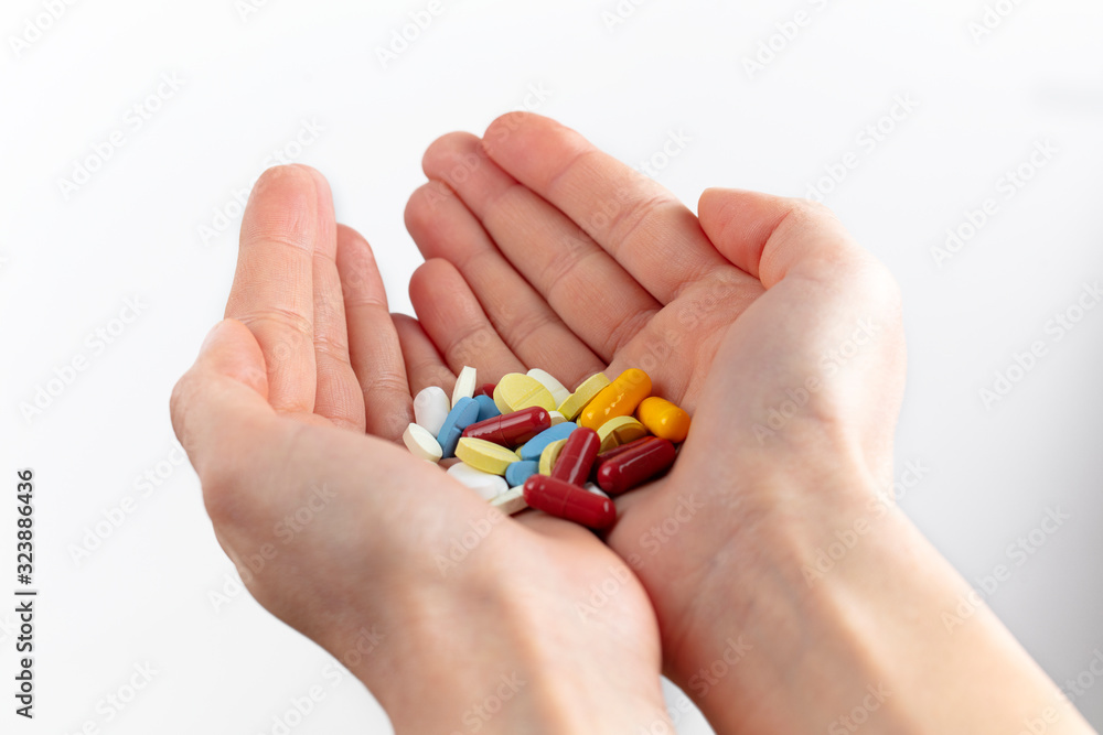 a handful of various colorful pills and vitamin pills a handful of various colorful pills and vitamin pills