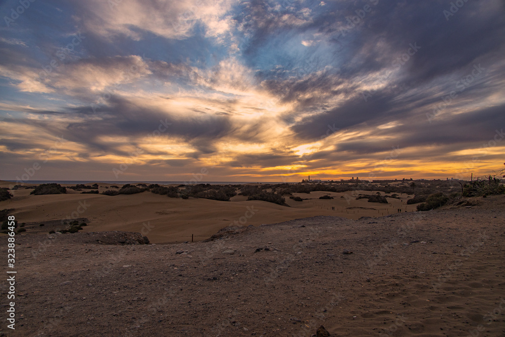 colorful sunset on the Spanish island of Gran Canaria in the Maspalomas dunes colorful sunset on the Spanish island of Gran Canaria in the Maspalomas dunes
