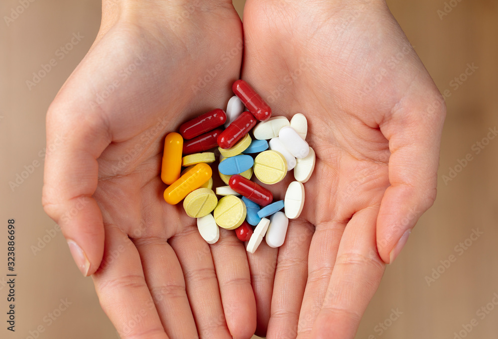a handful of various colorful pills and vitamin pills a handful of various colorful pills and vitamin pills