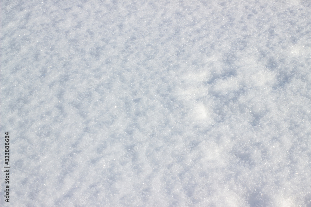 Real snow surface to use background texture. Pure fluffy snow. Just falling white snow. White snowflakes. Pure fluffy snow.