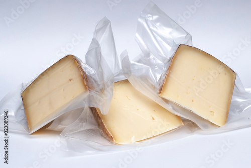 Vacuum cheese in a white background