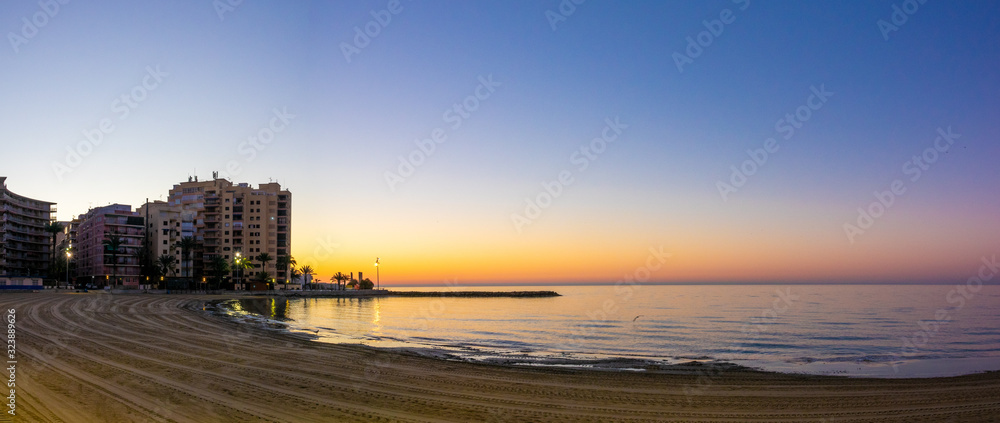 Beach street of Torrevieja Spain during sunrise