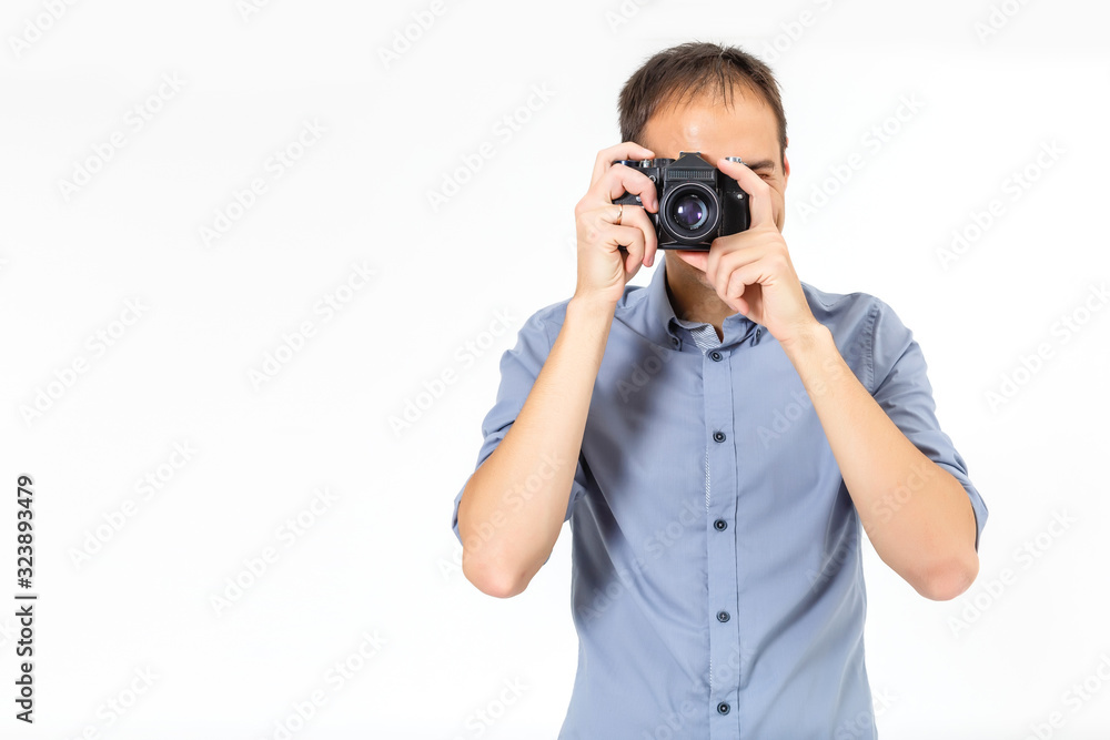 Bend young man taking photo with digital camera side view. isolated over white background. Bend young man taking photo with digital camera side view. isolated over white background.