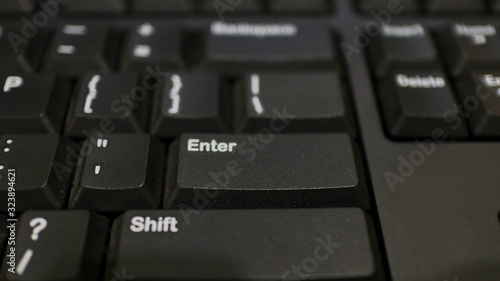 The ENTER key on the black keyboard, and various other keys to make typing easier