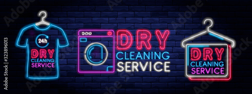 Dry cleaning service neon banner. Laundry room neon symbol on background of brick wall vector illustration. 24 hour laundromat service night neon signboard.