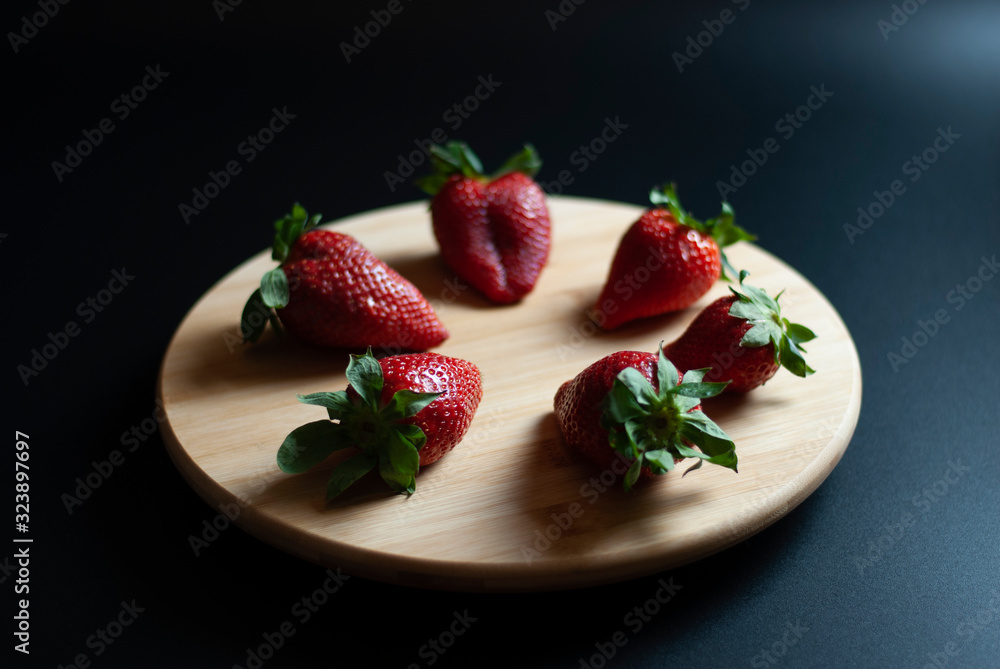 Strawberries on round wood tray Strawberries on round wood tray