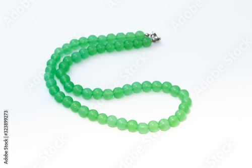 Green nephritis beads isolated on white background