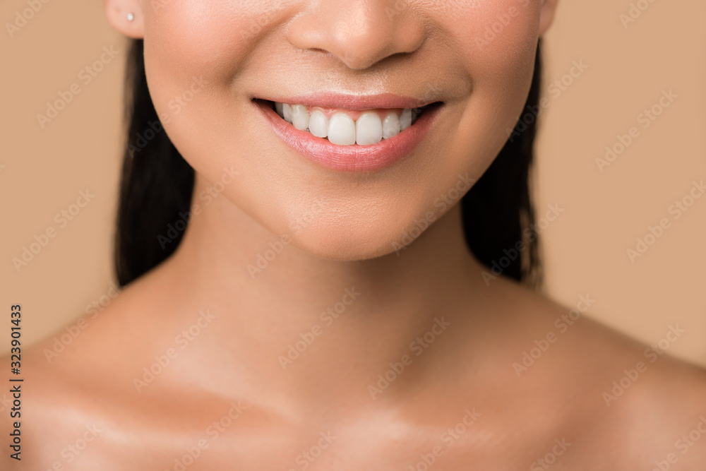cropped view of smiling beautiful naked asian girl isolated on beige cropped view of smiling beautiful naked asian girl isolated on beige