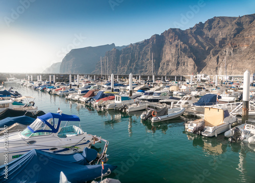 Beautiful image of harbor with moored motorboats and yacht at Los Gigantes, Tenerife island © Кирилл Рыжов