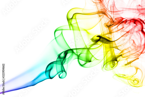 Rainbow smoke on white background. Smoke goes from bottom to top. Smoke spirals closer to top of the photo