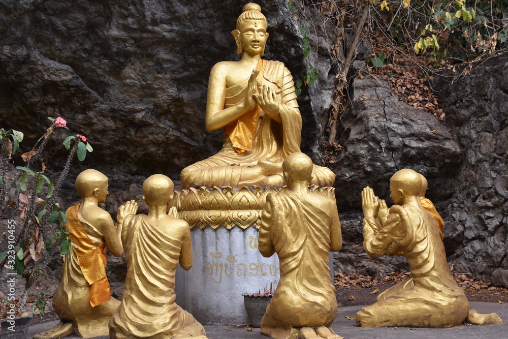 Dharmachakra Mudra Buddha Statue with Statues of Monks, Luang Prabang, Laos  Stock Photo | Adobe Stock