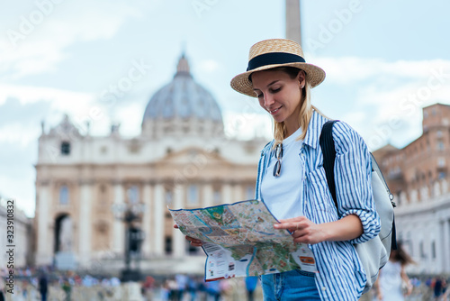 Photography Attractive Caucasian tourist checking information from paper map for navigate ow