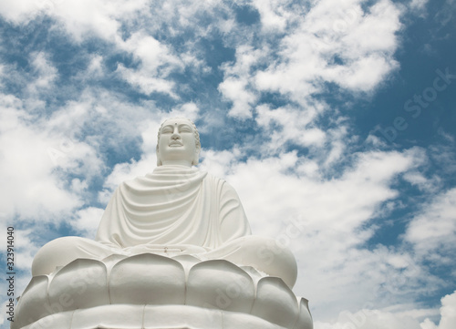 Big white buddha against the blue sky
