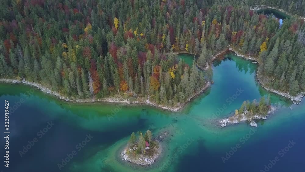 Couple sitting on a Rock at Eibsee, Germany Couple sitting on a Rock at Eibsee, Germany