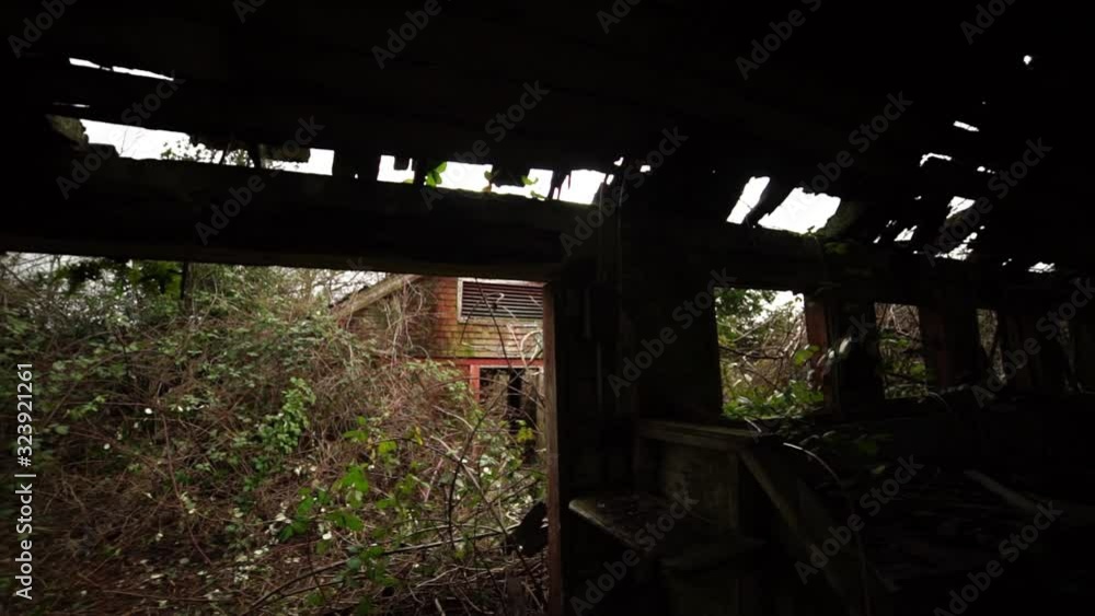 Slow pan from right to left of the dark and gloomy interior of an abandonded food processing building located on the grounds of an insane asylum, creepy, derelict Slow pan from right to left of the dark and gloomy interior of an abandonded food processing building located on the grounds of an insane asylum, creepy, derelict