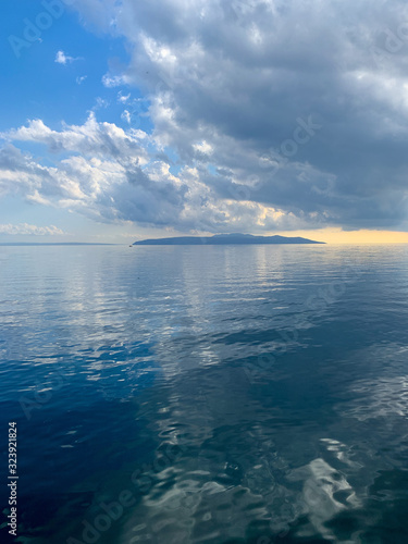 Sky reflection on the surface of the sea, natural colors © Oksana
