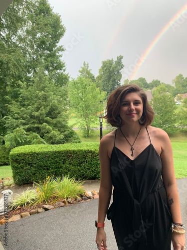 young woman and a rainbow