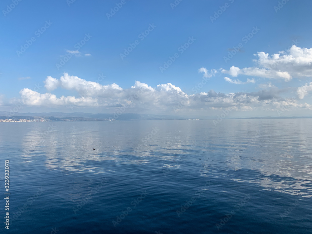 Sky reflection on the surface of the sea, natural colors Sky reflection on the surface of the sea, natural colors