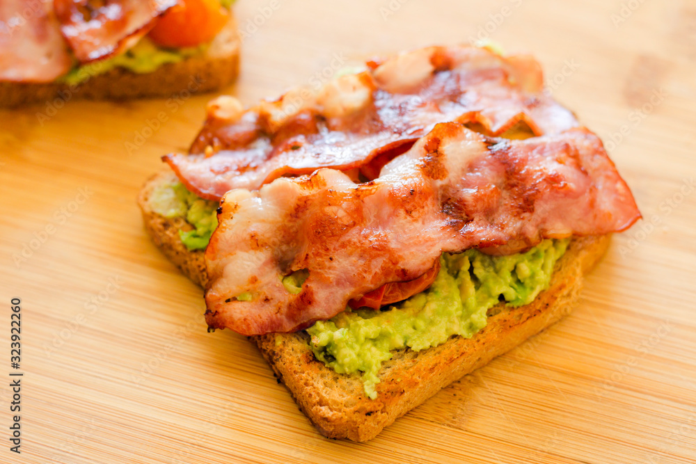 avocado toast with cherries tomatoes and bacon